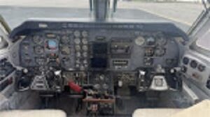 View looking forward of th Beech King Air 100 instrument panel, windshield and glare shield. 